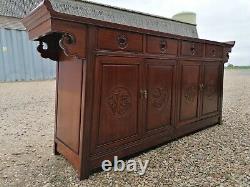 A Impressive Large Chinese Sideboard with Dragon Carvings and Fretwork