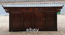 A Impressive Large Chinese Sideboard with Dragon Carvings and Fretwork