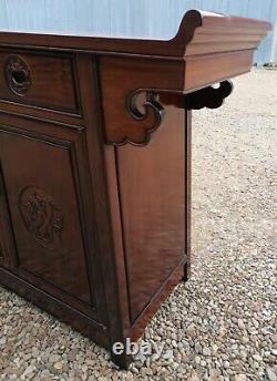 A Impressive Large Chinese Sideboard with Dragon Carvings and Fretwork