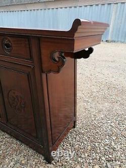 A Impressive Large Chinese Sideboard with Dragon Carvings and Fretwork