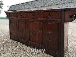 A Impressive Large Chinese Sideboard with Dragon Carvings and Fretwork