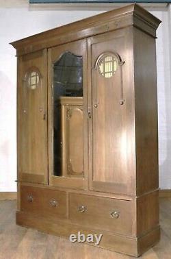 Antique good quality large Arts and crafts carved oak double door wardrobe