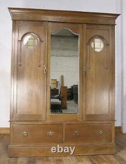 Antique good quality large Arts and crafts carved oak double door wardrobe