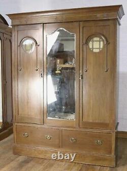 Antique good quality large Arts and crafts carved oak double door wardrobe