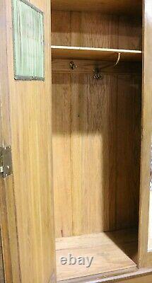 Antique good quality large Arts and crafts carved oak double door wardrobe