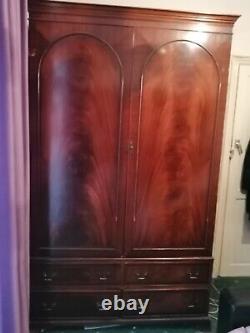 Large solid heavy duty wooden wardrobe. 4 big drawers. Brass fittings. Paid