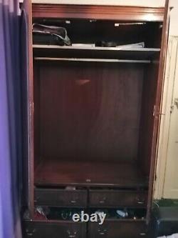 Large solid heavy duty wooden wardrobe. 4 big drawers. Brass fittings. Paid