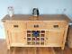 Large solid oak sideboard with built in wine storage, 2 doors, and 3 drawers