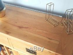 Large solid oak sideboard with built in wine storage, 2 doors, and 3 drawers