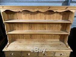 Large solid pine four door/drawer dresser sideboard with plate rack shelved top