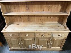 Large solid pine four door/drawer dresser sideboard with plate rack shelved top