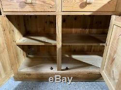 Large solid pine four door/drawer dresser sideboard with plate rack shelved top