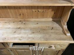 Large solid pine four door/drawer dresser sideboard with plate rack shelved top