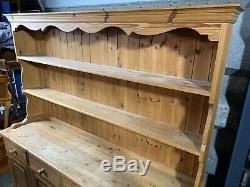 Large solid pine four door/drawer dresser sideboard with plate rack shelved top