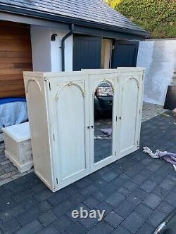 Large triple door wardrobe and drawers in off white in three sections