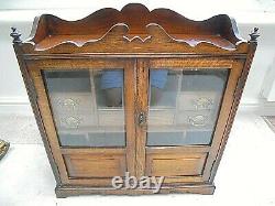 Large vintage oak smokers cabinet bevelled glass doors, 7 drawers jewellery huge