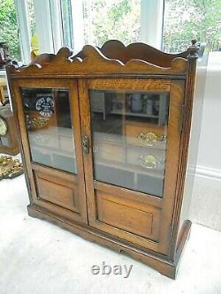 Large vintage oak smokers cabinet bevelled glass doors, 7 drawers jewellery huge