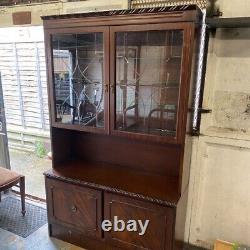 Large wooden display cabinet with glass doors, unbranded wooden