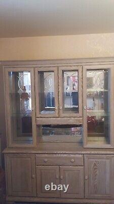 Large wooden display cabinet with glass doors, unbranded wooden